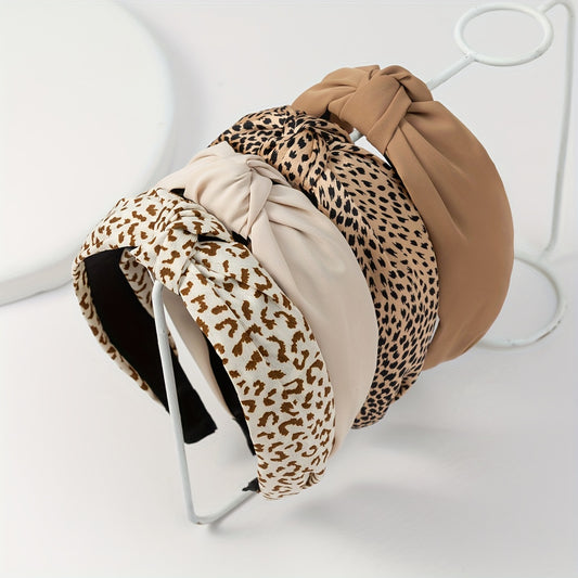 Multiple leopard print and solid-color polyester headbands arranged in a fashion set.