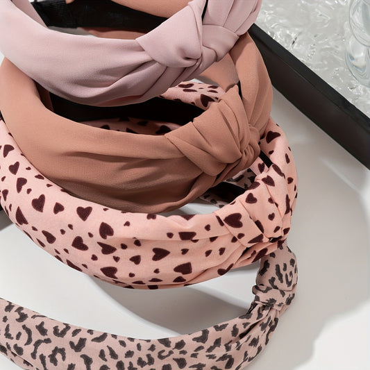 Close-up of vintage knot headband with elegant leopard print design.
