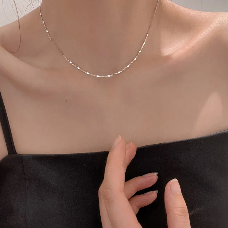 Model wearing minimalist silver clavicle necklace