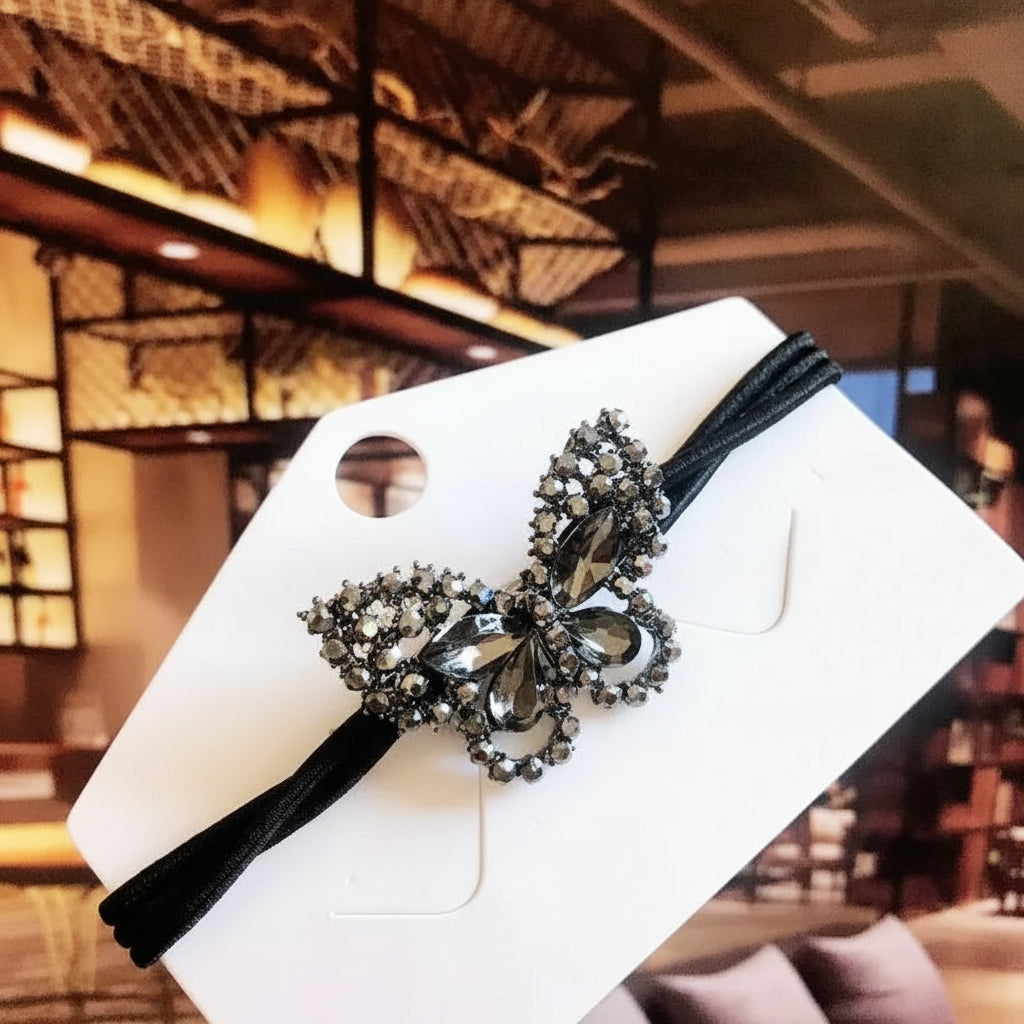 Decorative elastic hair bands for women featuring rhinestones, bows, pearls and alloy charms, styled for ponytails and daily fashion use. 