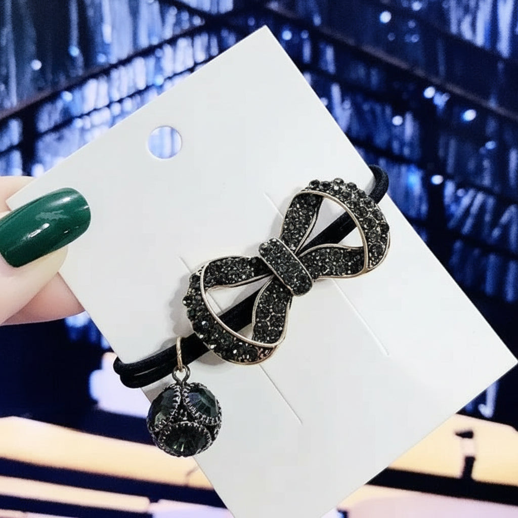 Decorative elastic hair bands for women featuring rhinestones, bows, pearls and alloy charms, styled for ponytails and daily fashion use. 