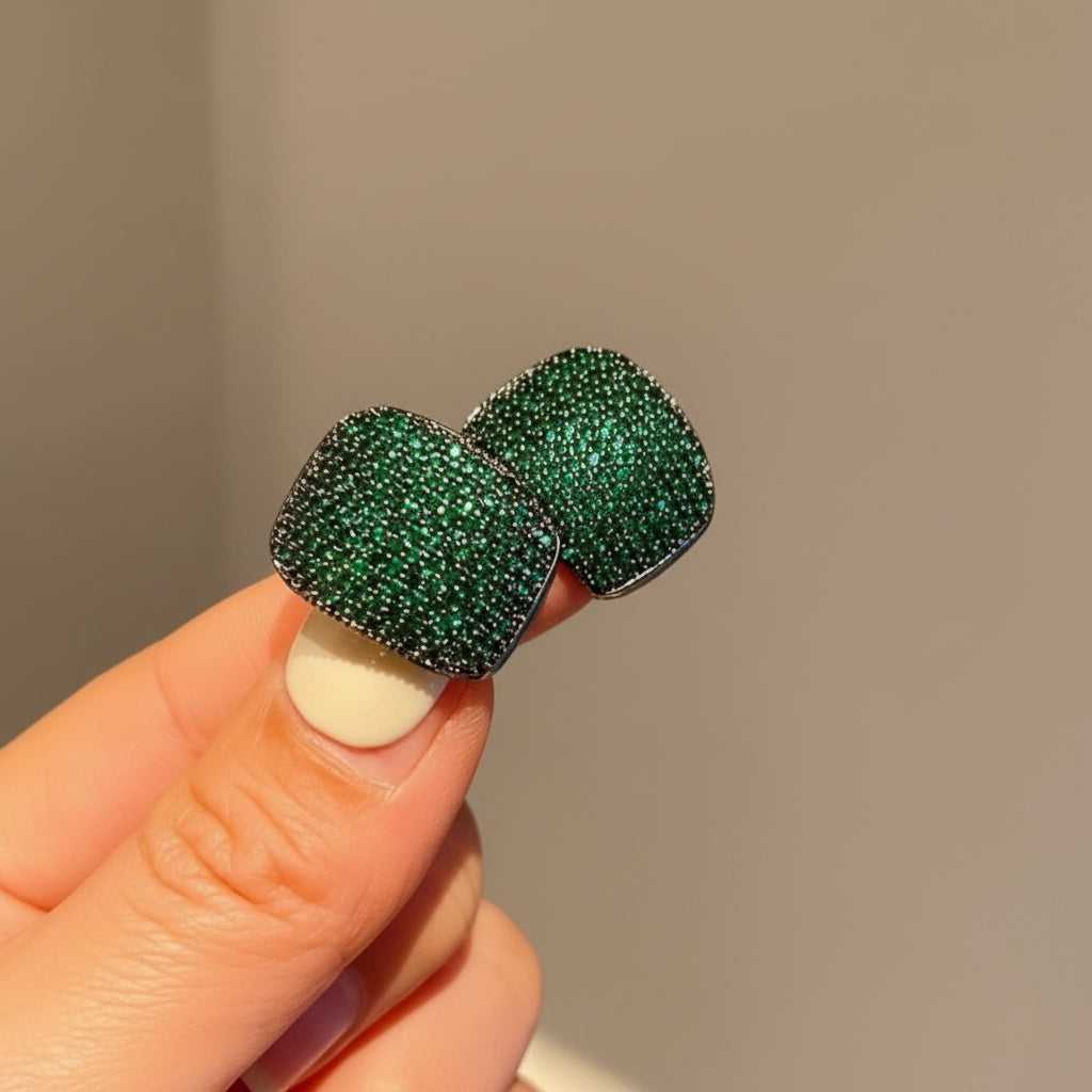 Emerald green zircon stud earrings close-up