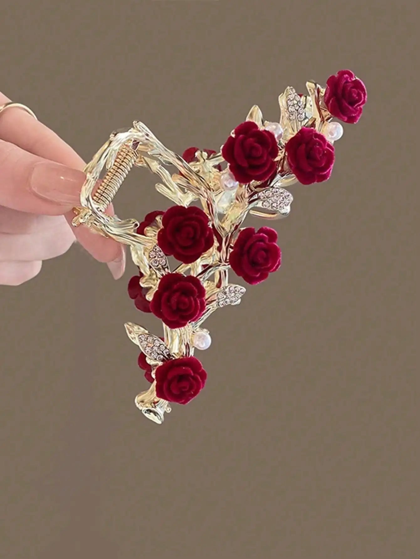 Gold floral rose hair claw with red roses and pearl chain decorations.