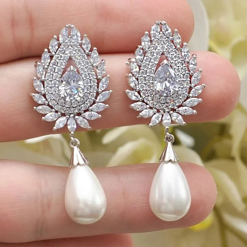 Elegant zircon crystal and simulated pearl stud earrings for women featuring floral and geometric designs, lightweight fashion jewelry.