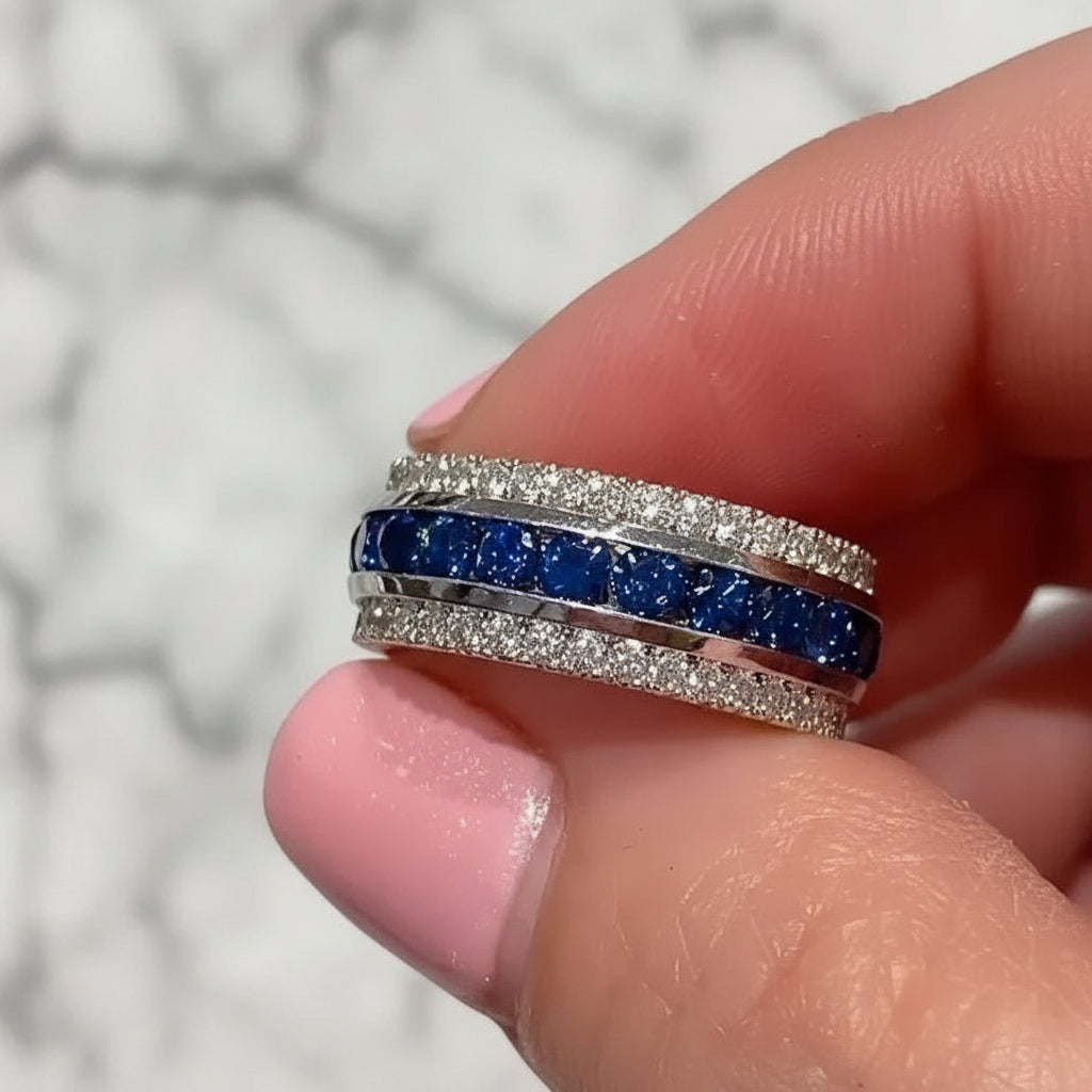 Women’s brass ring with channel-set cubic zirconia, geometric wedding band design.