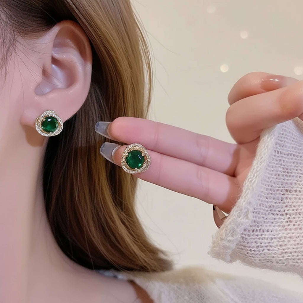 Model wearing emerald rhinestone stud earrings