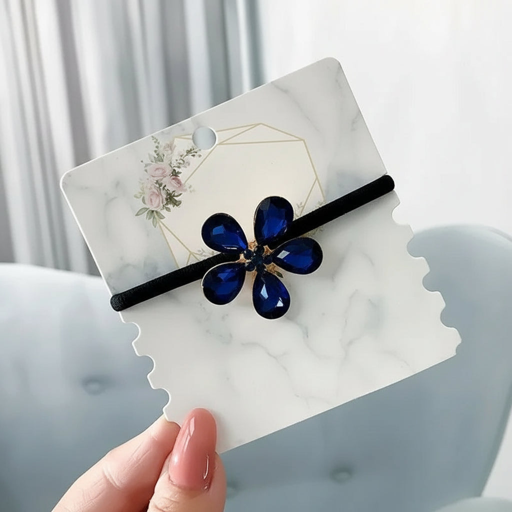 Decorative elastic hair bands for women featuring rhinestones, bows, pearls and alloy charms, styled for ponytails and daily fashion use. 