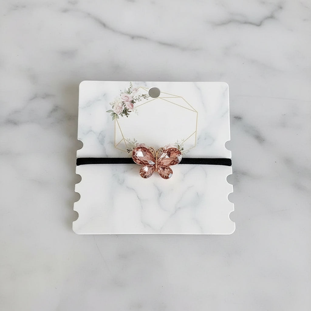 Decorative elastic hair bands for women featuring rhinestones, bows, pearls and alloy charms, styled for ponytails and daily fashion use. 