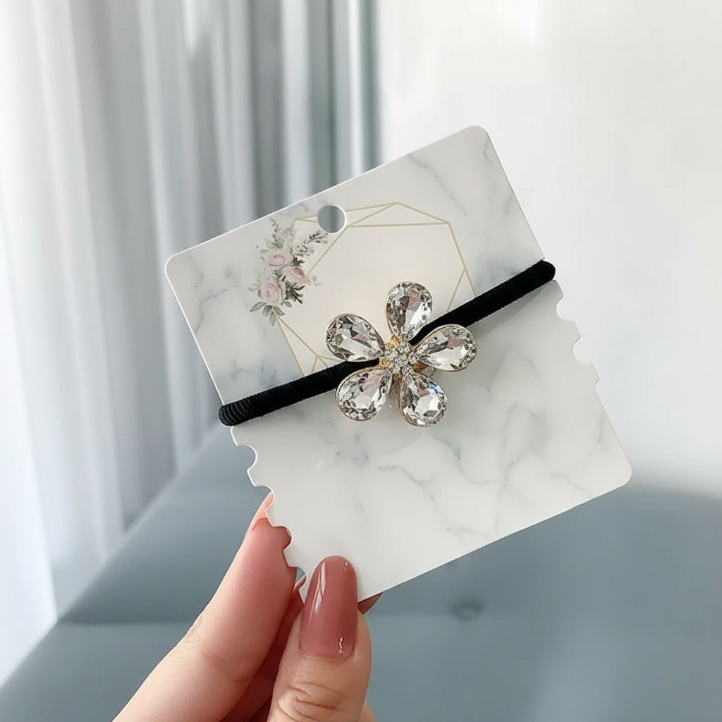 Decorative elastic hair bands for women featuring rhinestones, bows, pearls and alloy charms, styled for ponytails and daily fashion use. 