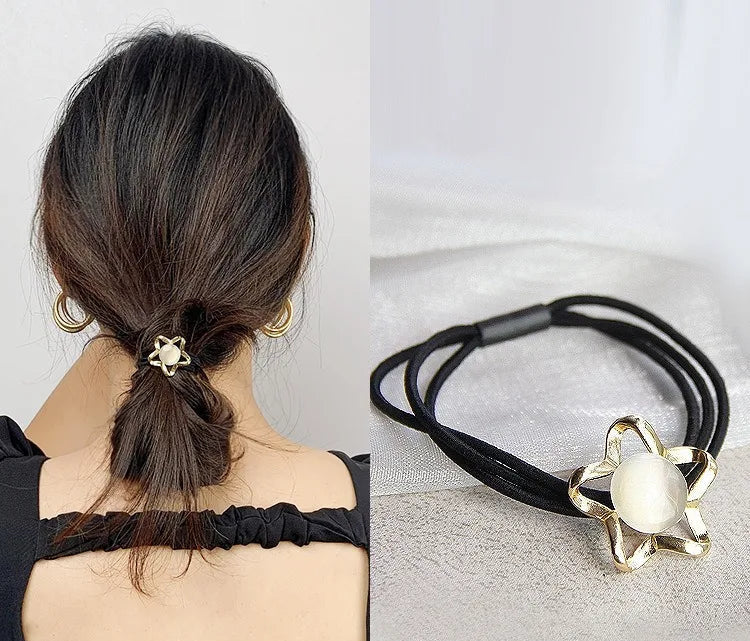 Decorative elastic hair bands for women featuring rhinestones, bows, pearls and alloy charms, styled for ponytails and daily fashion use. 