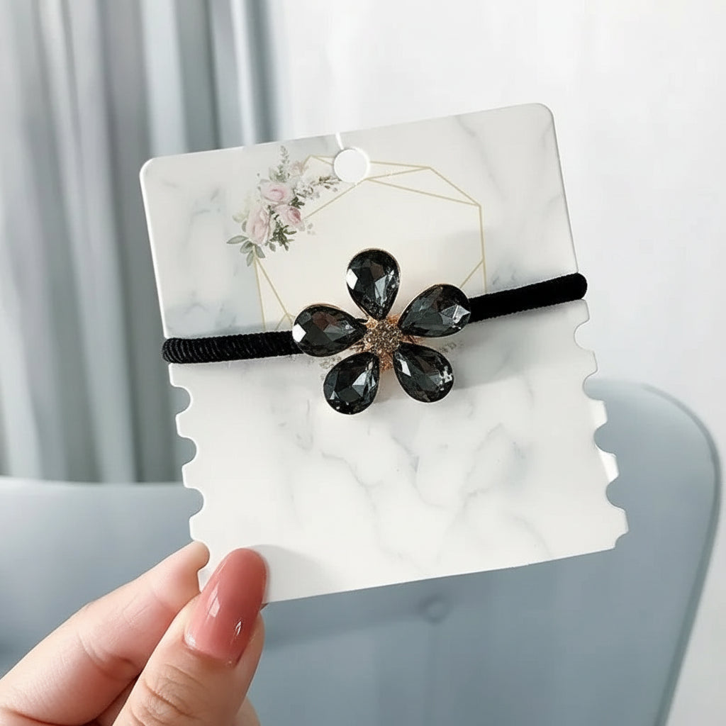 Decorative elastic hair bands for women featuring rhinestones, bows, pearls and alloy charms, styled for ponytails and daily fashion use. 