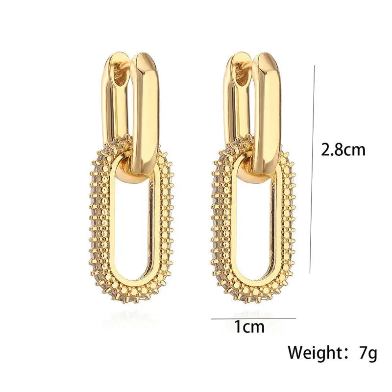 Close-up detail of rhinestone chain-link hoop earrings with trendy double-link pattern.