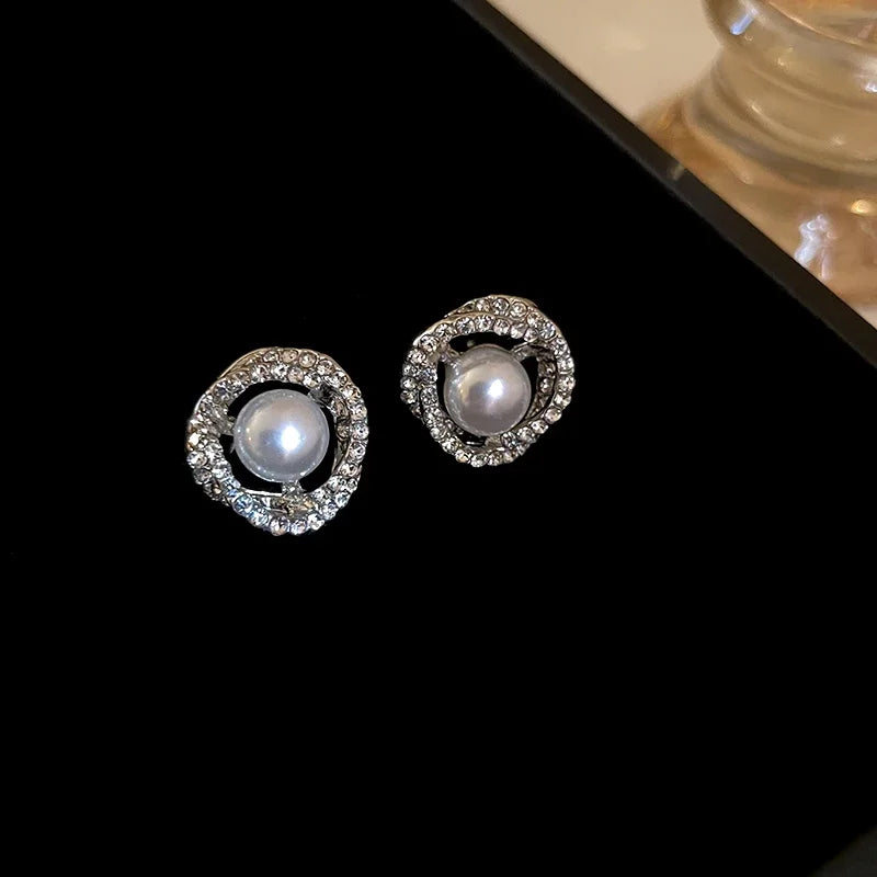 Silver and pearl version of halo stud earrings