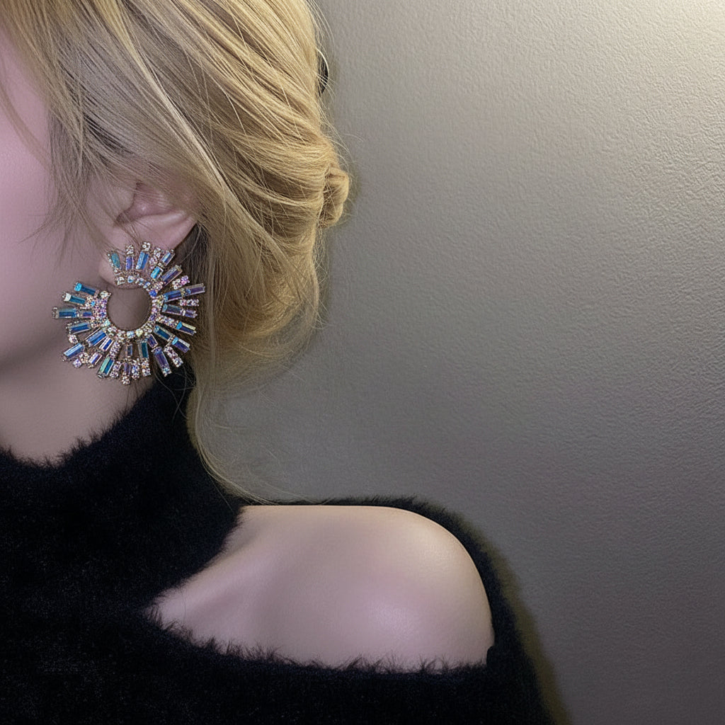 Model showcasing large geometric crystal earrings