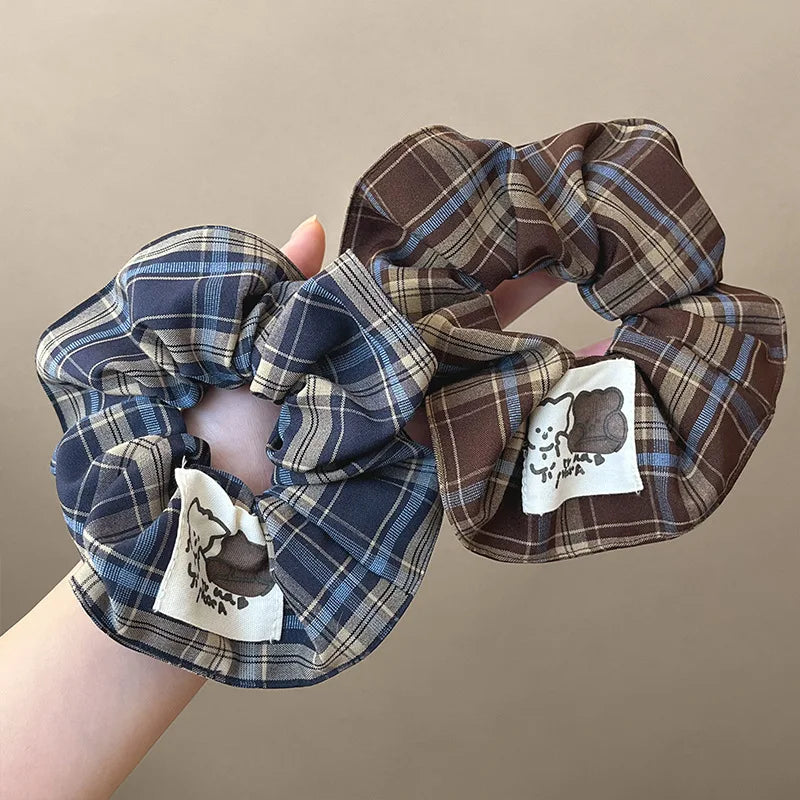 Brown and blue plaid check scrunchie for women, soft fabric hair band.