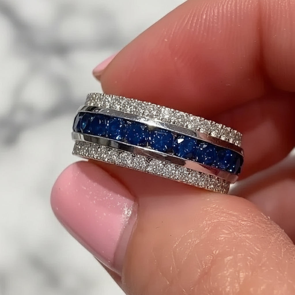 Women’s brass ring with channel-set cubic zirconia, geometric wedding band design.