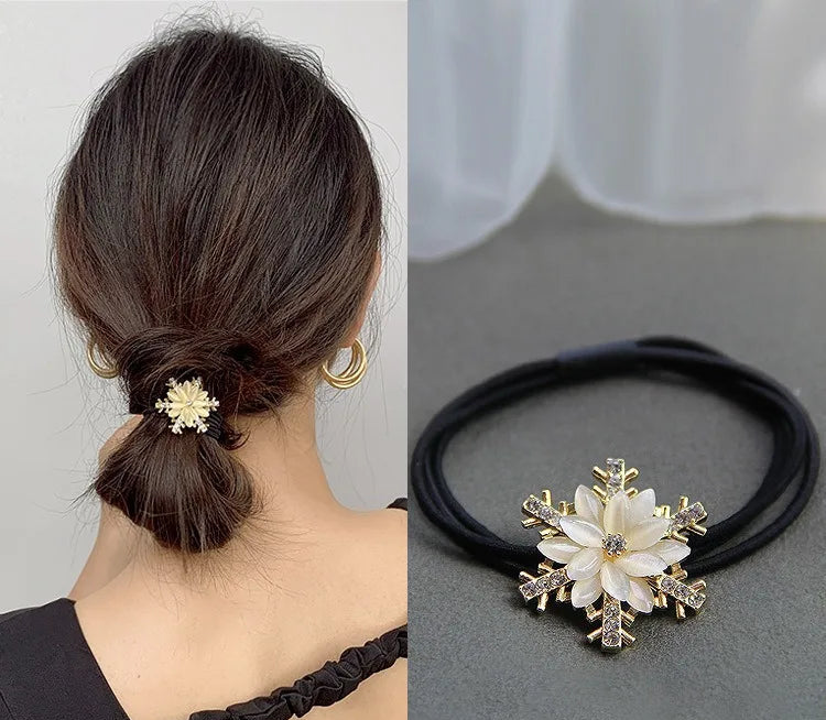 Decorative elastic hair bands for women featuring rhinestones, bows, pearls and alloy charms, styled for ponytails and daily fashion use. 